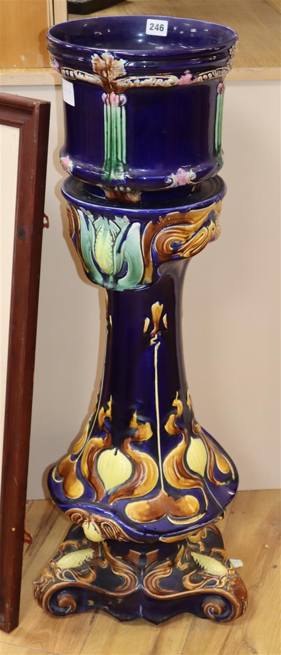 An Edwardian pottery jardiniere and stand